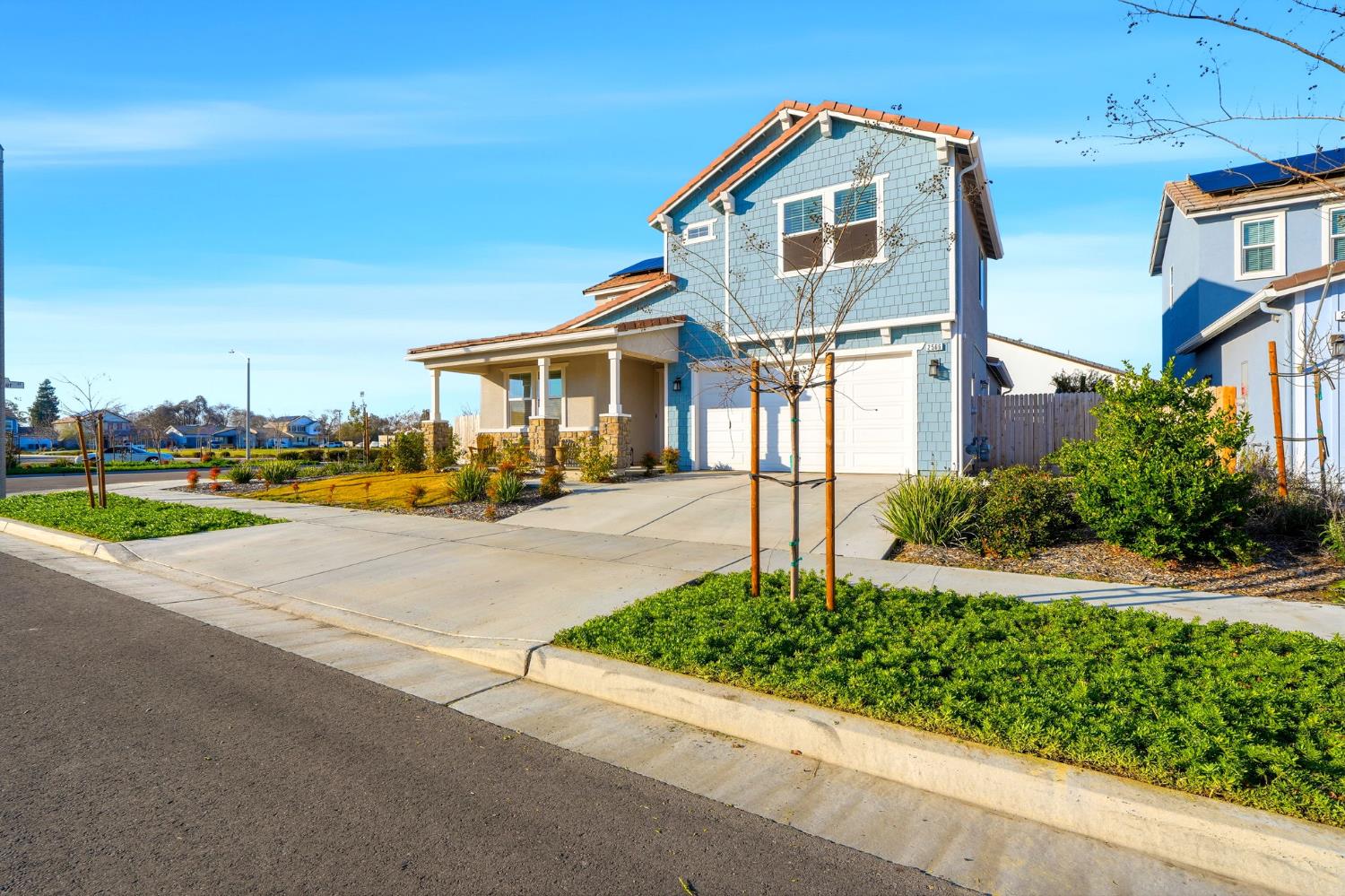 2566 Muscat Court Hanford, CA 93230 - Photo 2 of 55 a front view of a house with a yard