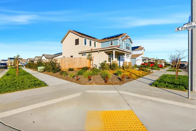 an aerial view of a house with a swimming pool