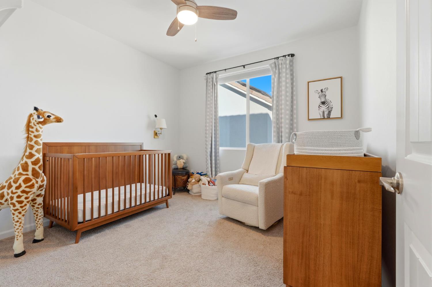 2566 Muscat Court Hanford, CA 93230 - Photo 32 of 55 a bed room with a bed and a couch