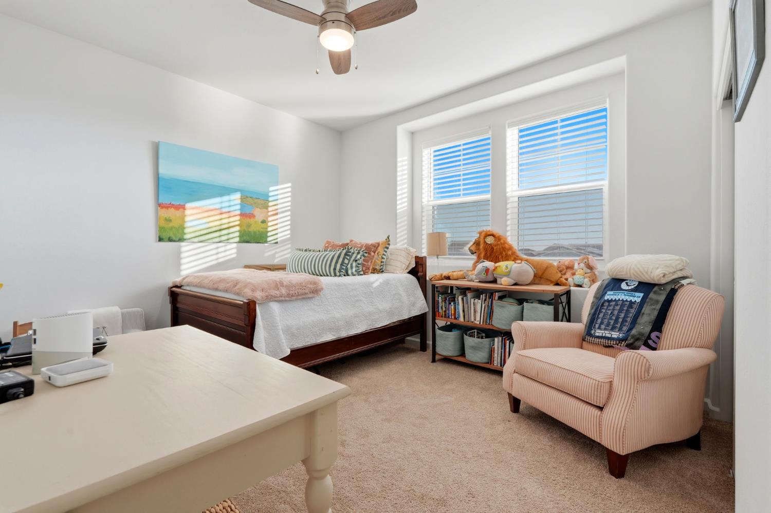 2566 Muscat Court Hanford, CA 93230 - Photo 34 of 55 a bedroom with two beds and large windows