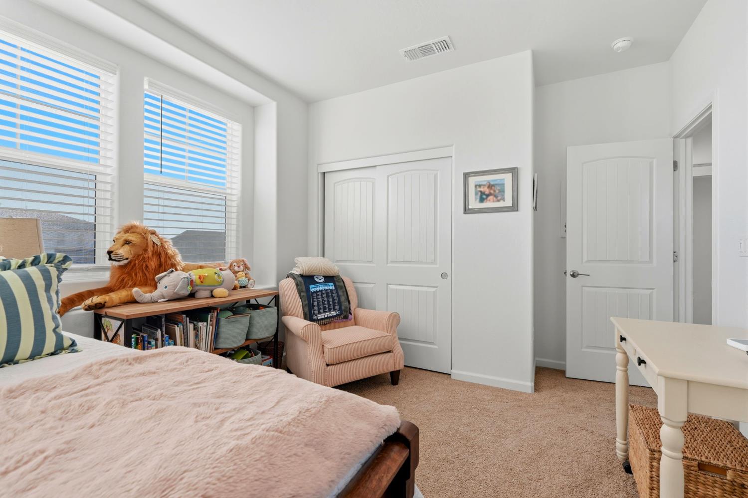 2566 Muscat Court Hanford, CA 93230 - Photo 35 of 55 a bedroom with two beds and a couch
