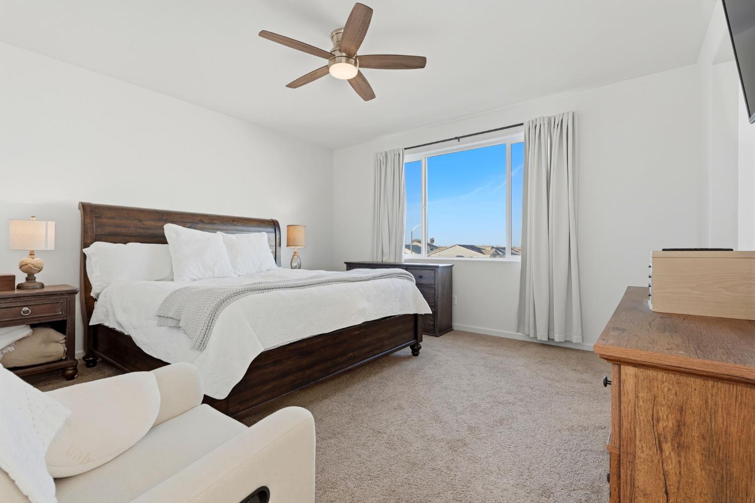 2566 Muscat Court Hanford, CA 93230 - Photo 39 of 55 a bedroom with a bed and a table
