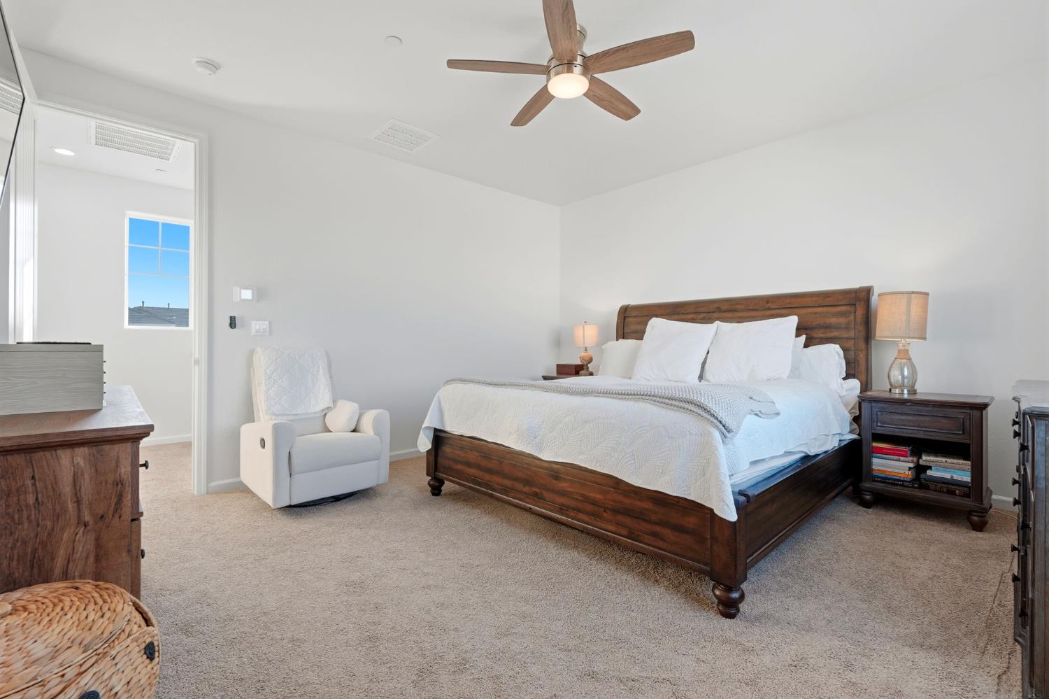 2566 Muscat Court Hanford, CA 93230 - Photo 40 of 55 a bed sitting in a bedroom and couch