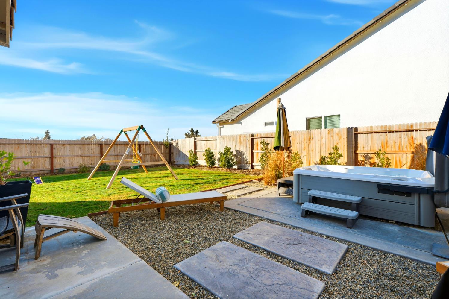 2566 Muscat Court Hanford, CA 93230 - Photo 47 of 55 a sitting area with chairs and table in the backyard