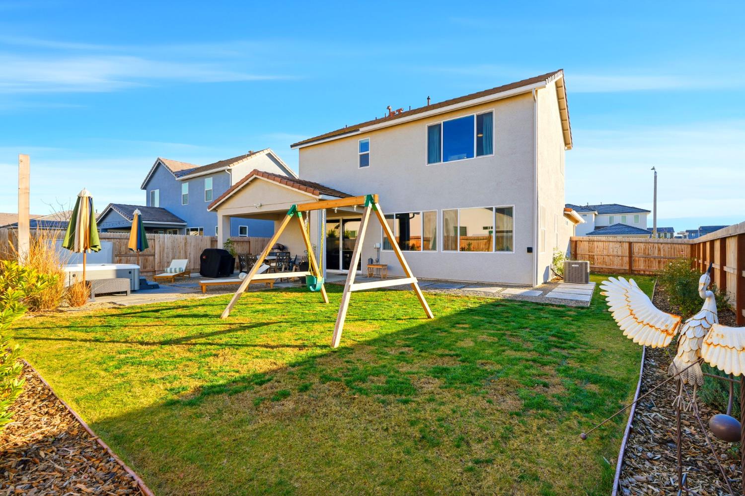 2566 Muscat Court Hanford, CA 93230 - Photo 52 of 55 a view of a house with a backyard