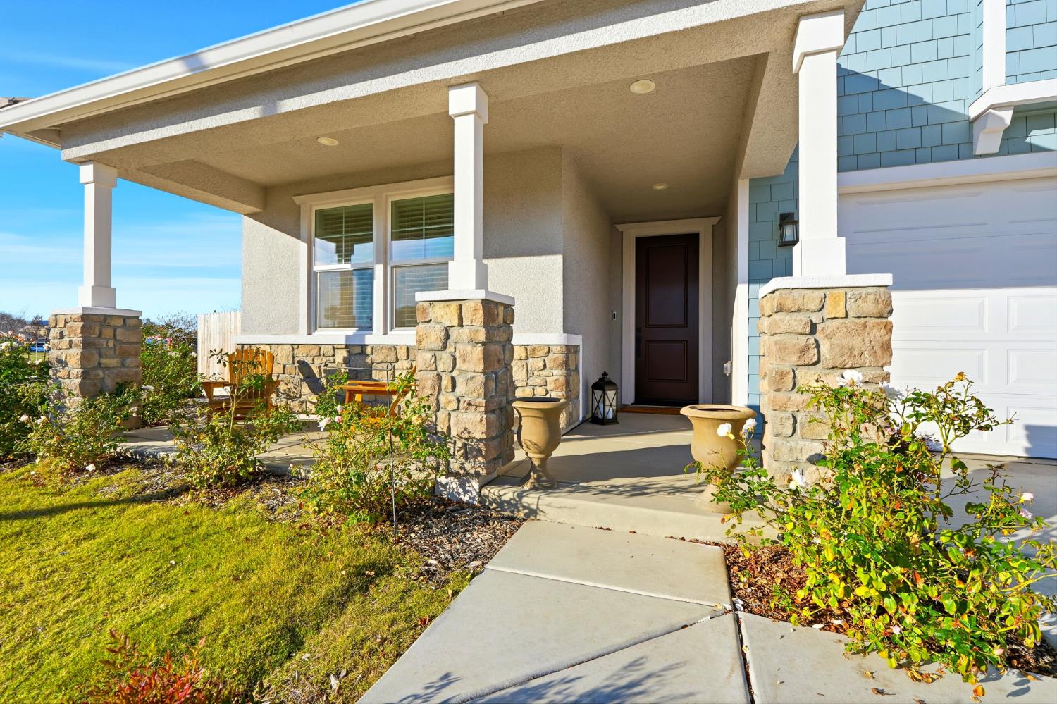 2566 Muscat Court Hanford, CA 93230 - Photo 7 of 55 a front view of a house with a garden