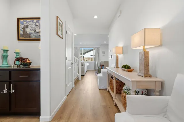 a kitchen with stainless steel appliances a refrigerator a stove a sink and a microwave