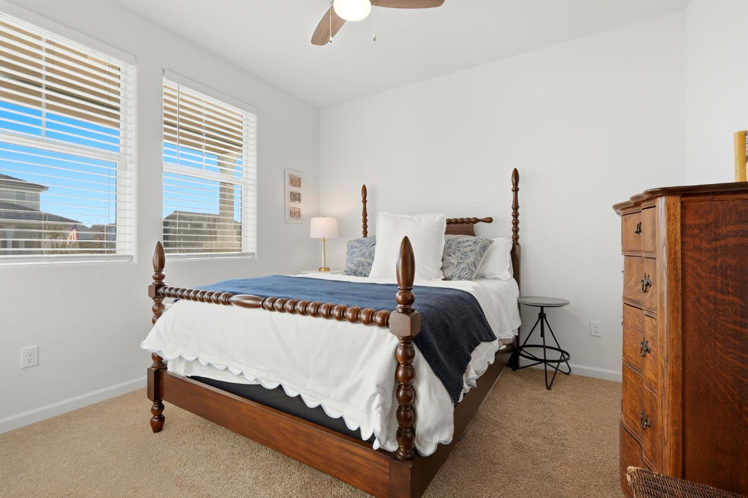 2566 Muscat Court Hanford, CA 93230 - Photo 10 of 55 a bedroom with a bed and a table