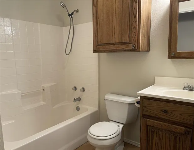 a view of a house with a yard and wooden fence