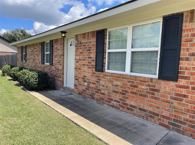 a front view of a house having yard