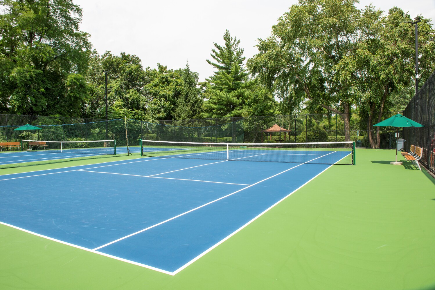 5700 Arlington Avenue, Unit 12E Bronx, NY 10471 - Photo 11 of 15 a view of tennis court with chairs