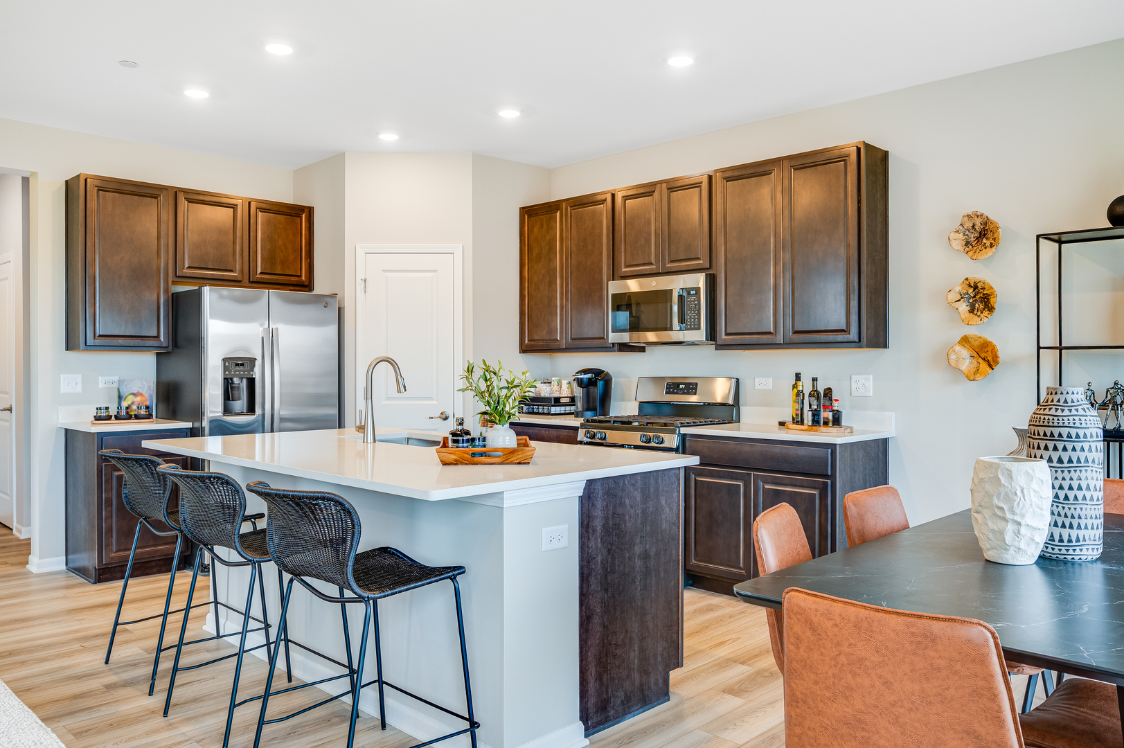 1255 Glenmont Street Algonquin, IL 60102 - Photo 9 of 21 a kitchen with stainless steel appliances kitchen island granite countertop a sink and cabinets