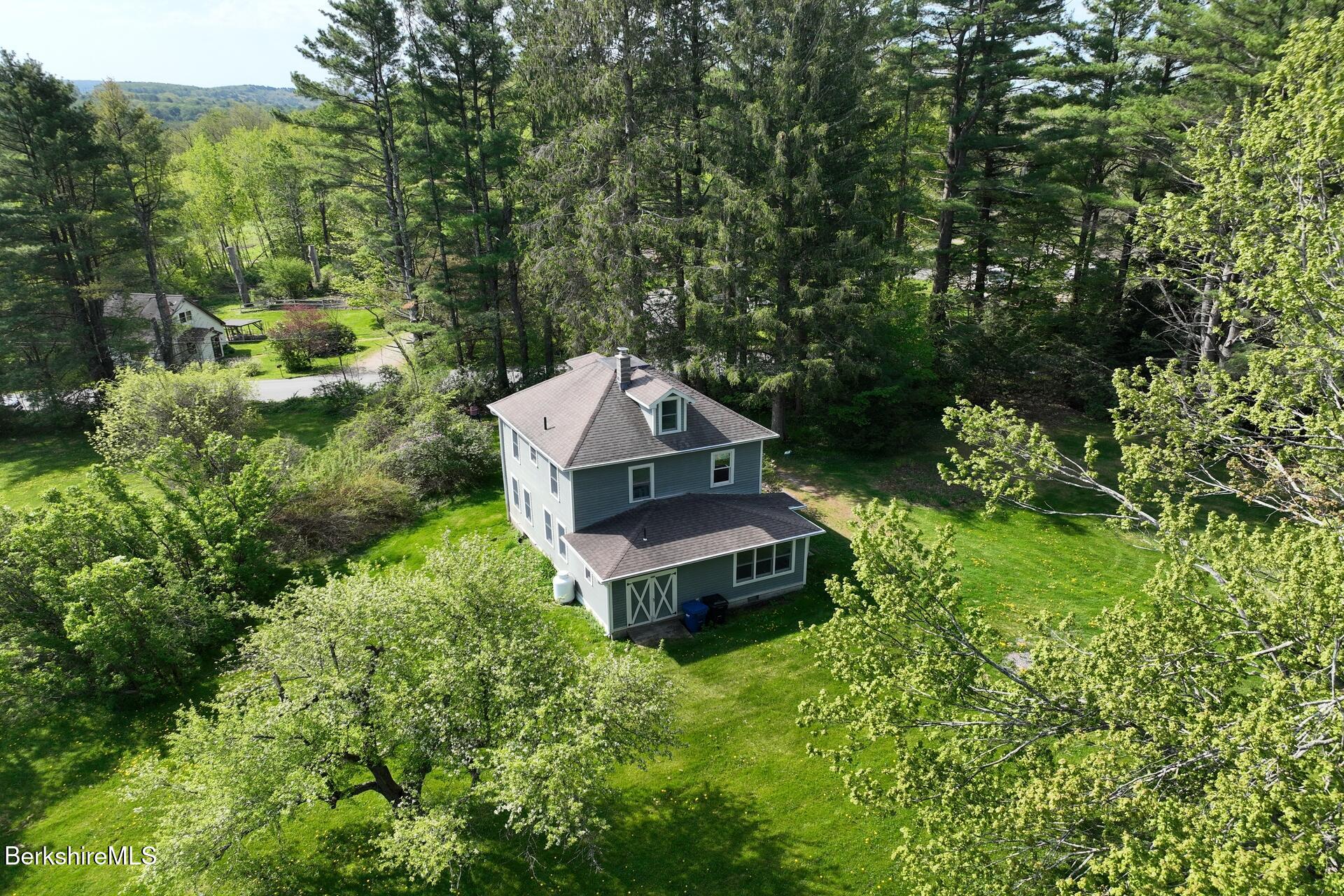 86 Miner Road Lanesborough, MA 01237 - Photo 8 of 44 an aerial view of a house with a yard