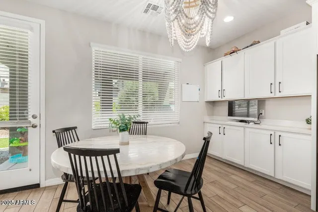 a view of a dining room with furniture window and outside view