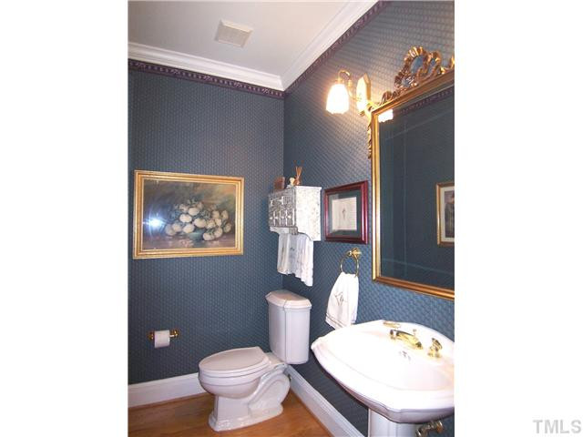908 Rockfall Court Raleigh, NC 27614 - Photo 10 of 25 Pretty Half-Bath has a pedestal sink & hardwd floor. Half Bath