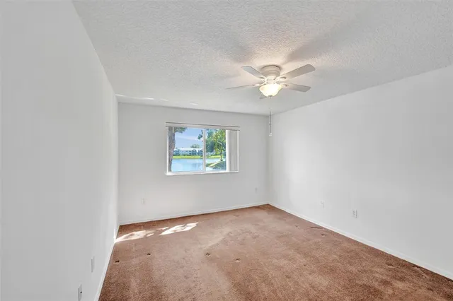 a spacious bathroom with a shower and a sink
