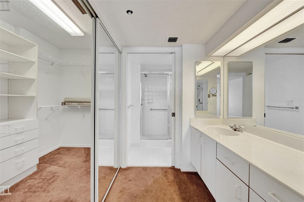 9563 Weldon Circle, Unit D212 Tamarac, FL 33321 - Photo 34 of 69 a bathroom with a sink and a mirror with bathtub