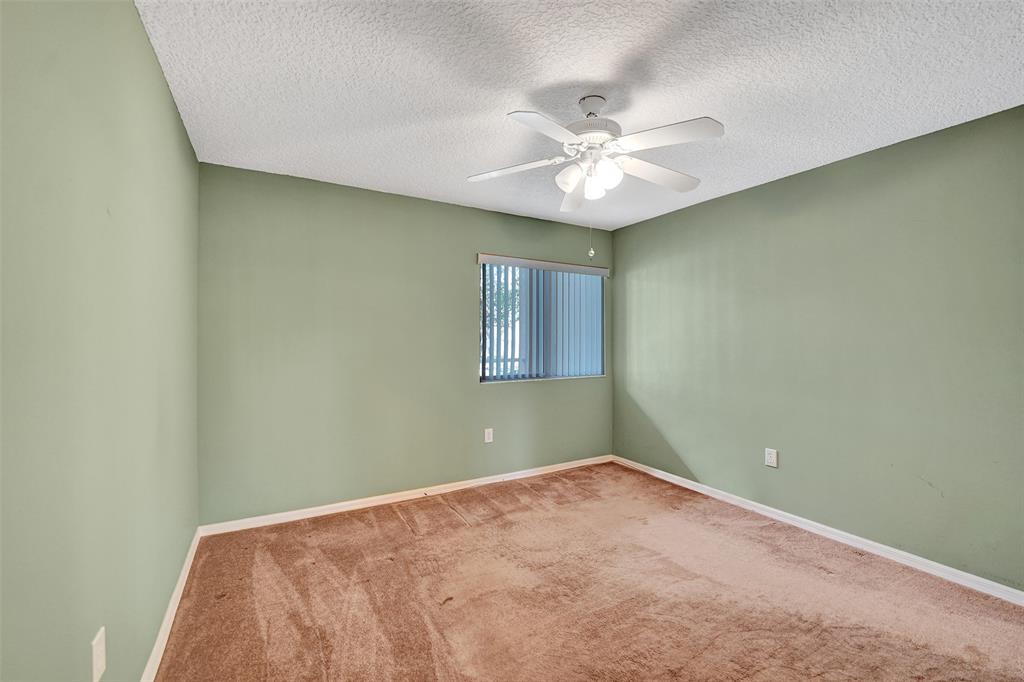 9563 Weldon Circle, Unit D212 Tamarac, FL 33321 - Photo 41 of 69 an empty room with a window and a fan