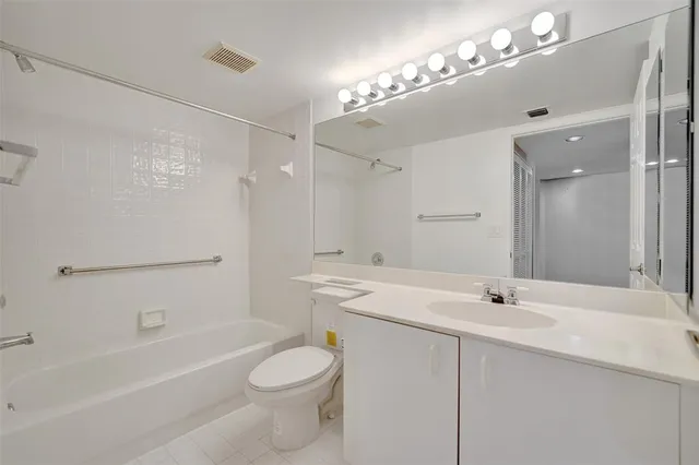 a view of a patio with couches table and chairs and potted plants