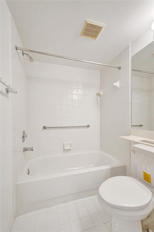 9563 Weldon Circle, Unit D212 Tamarac, FL 33321 - Photo 46 of 69 a bathroom with a tub shower sink and toilet