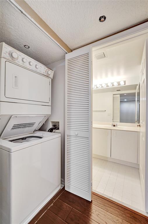 9563 Weldon Circle, Unit D212 Tamarac, FL 33321 - Photo 47 of 69 a utility room with washer and dryer