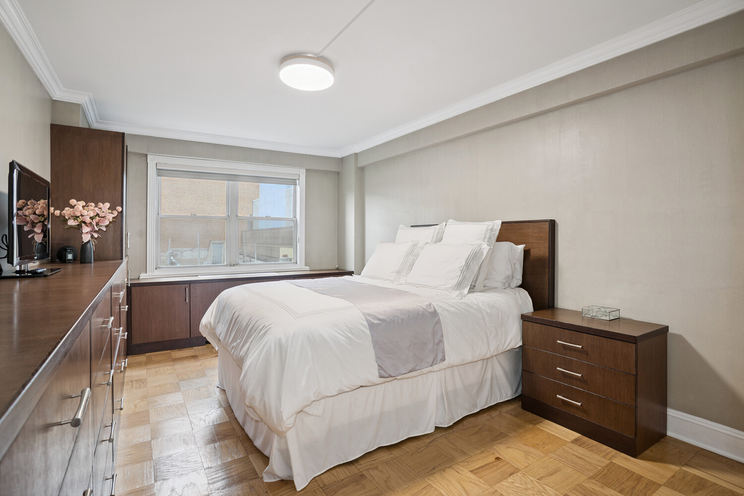 520 East 76th Street, Unit 8C Manhattan, NY 10021 - Photo 4 of 10 a bedroom with a bed and window