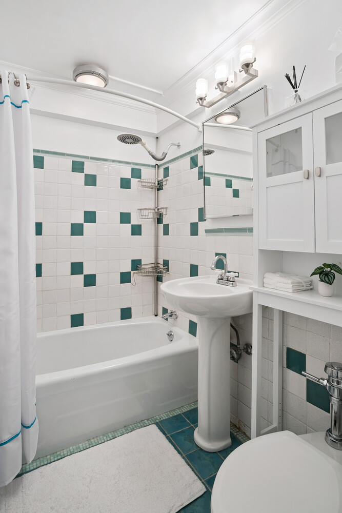 520 East 76th Street, Unit 8C Manhattan, NY 10021 - Photo 5 of 10 a bathroom with a sink toilet and shower