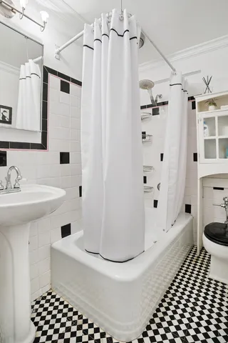 a room with a bed and a view of bathroom