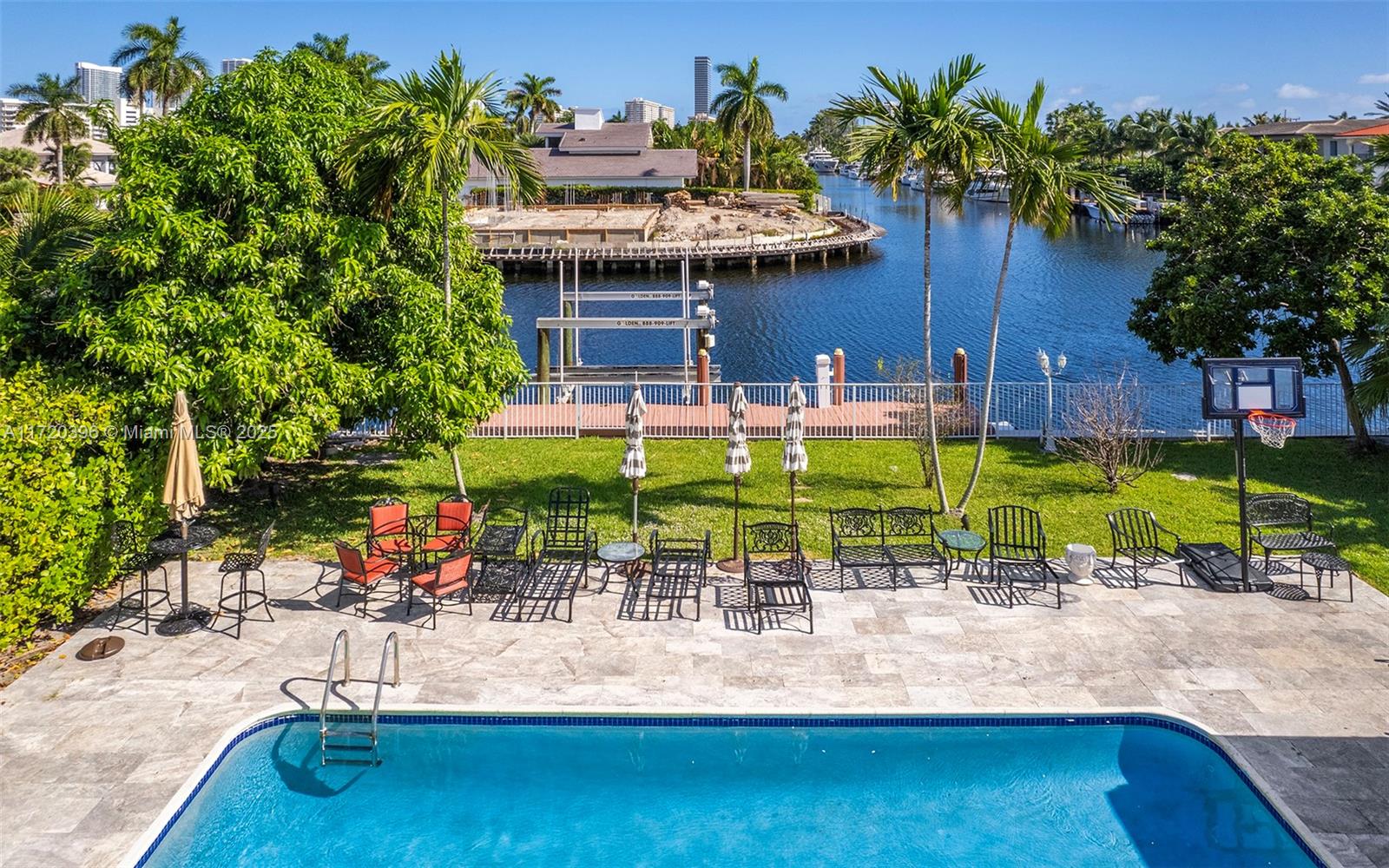 607 Layne Boulevard Hallandale Beach, FL 33009 - Photo 3 of 8 a view of a swimming pool with a patio