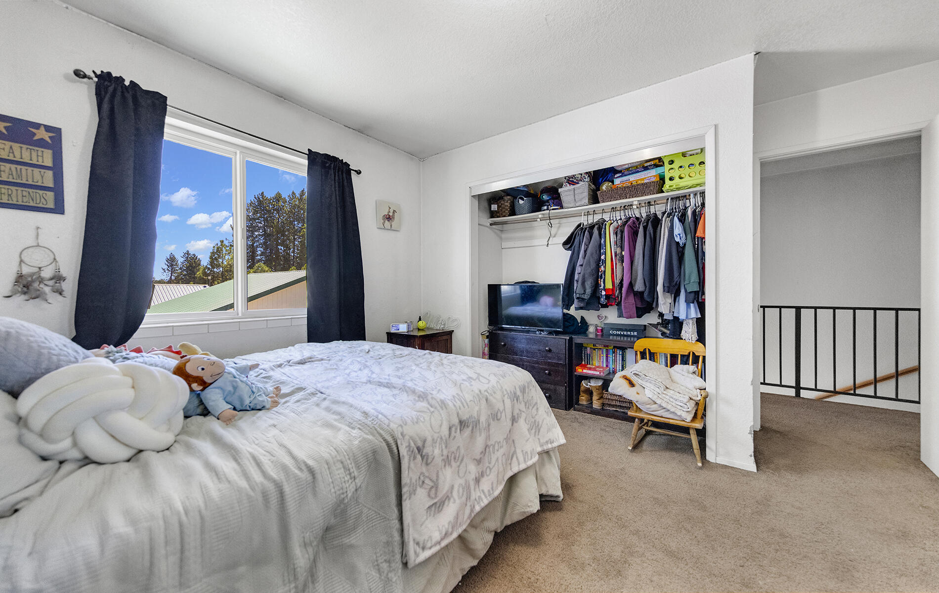 467 Martin Way Chester, CA 96020 - Photo 28 of 39 a bedroom with a bed and large window