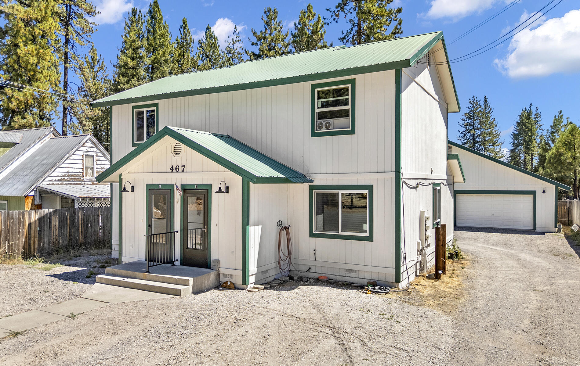 467 Martin Way Chester, CA 96020 - Photo 32 of 39 a front view of a house with a yard and garage