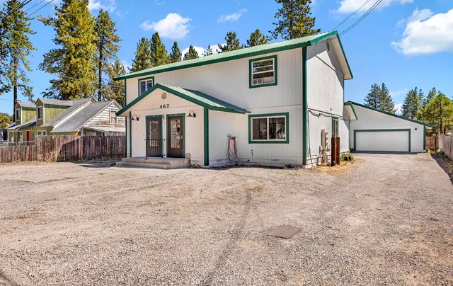 an aerial view of a swimming pool with outdoor seating