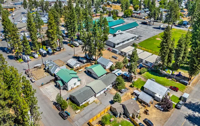 an aerial view of residential houses with outdoor space