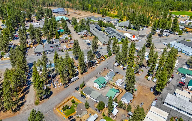 an aerial view of a houses with yard