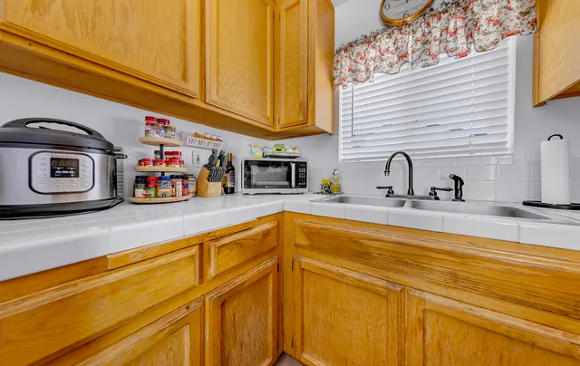 a kitchen with stainless steel appliances granite countertop a sink and cabinets