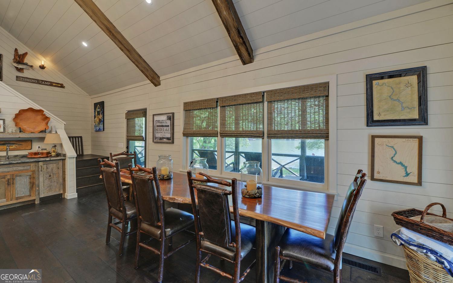 2857 Crow Creek Road Lakemont, GA 30552 - Photo 11 of 74 a view of a dining room with furniture window and wooden floor