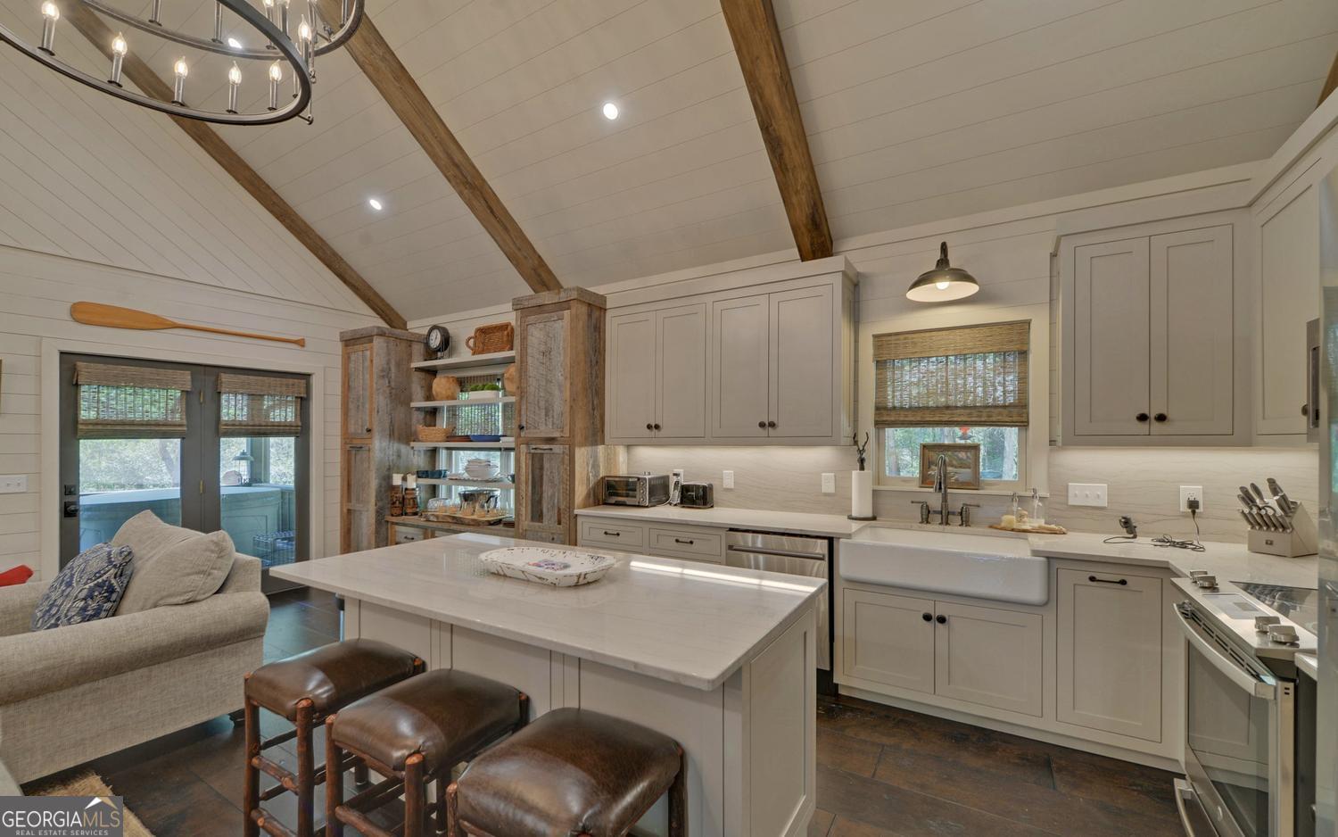 2857 Crow Creek Road Lakemont, GA 30552 - Photo 13 of 74 a kitchen with a sink dishwasher a stove a dining table and chairs
