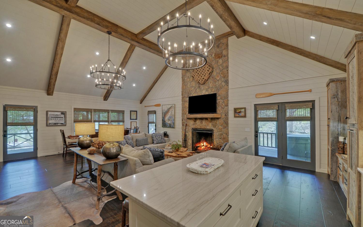 2857 Crow Creek Road Lakemont, GA 30552 - Photo 15 of 74 a living room with fireplace furniture and a chandelier