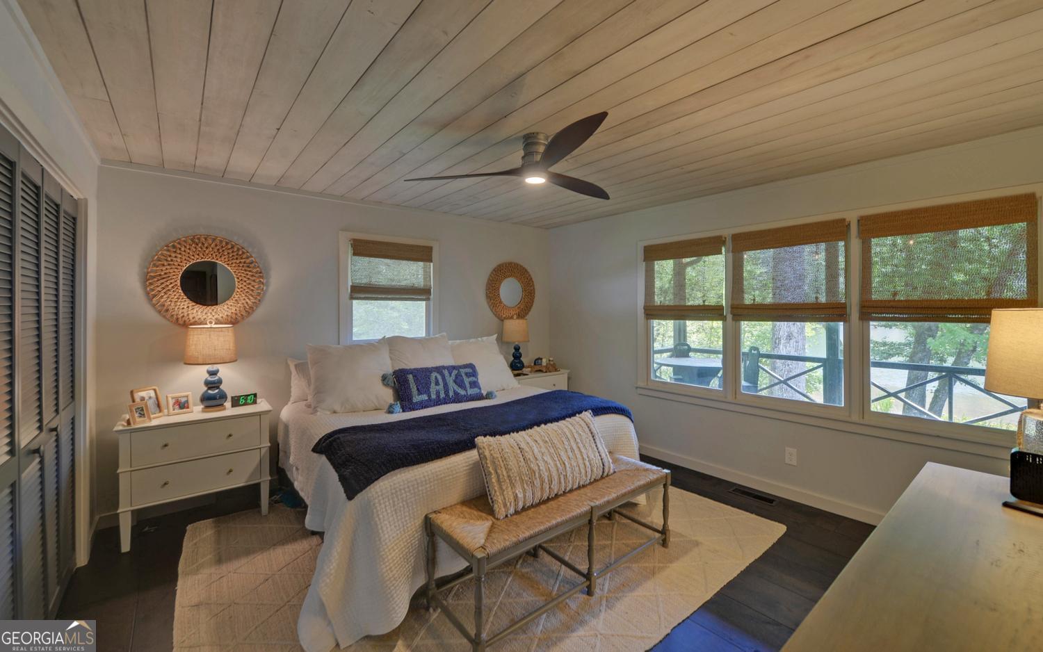 2857 Crow Creek Road Lakemont, GA 30552 - Photo 20 of 74 a bedroom with a bed and a chandelier