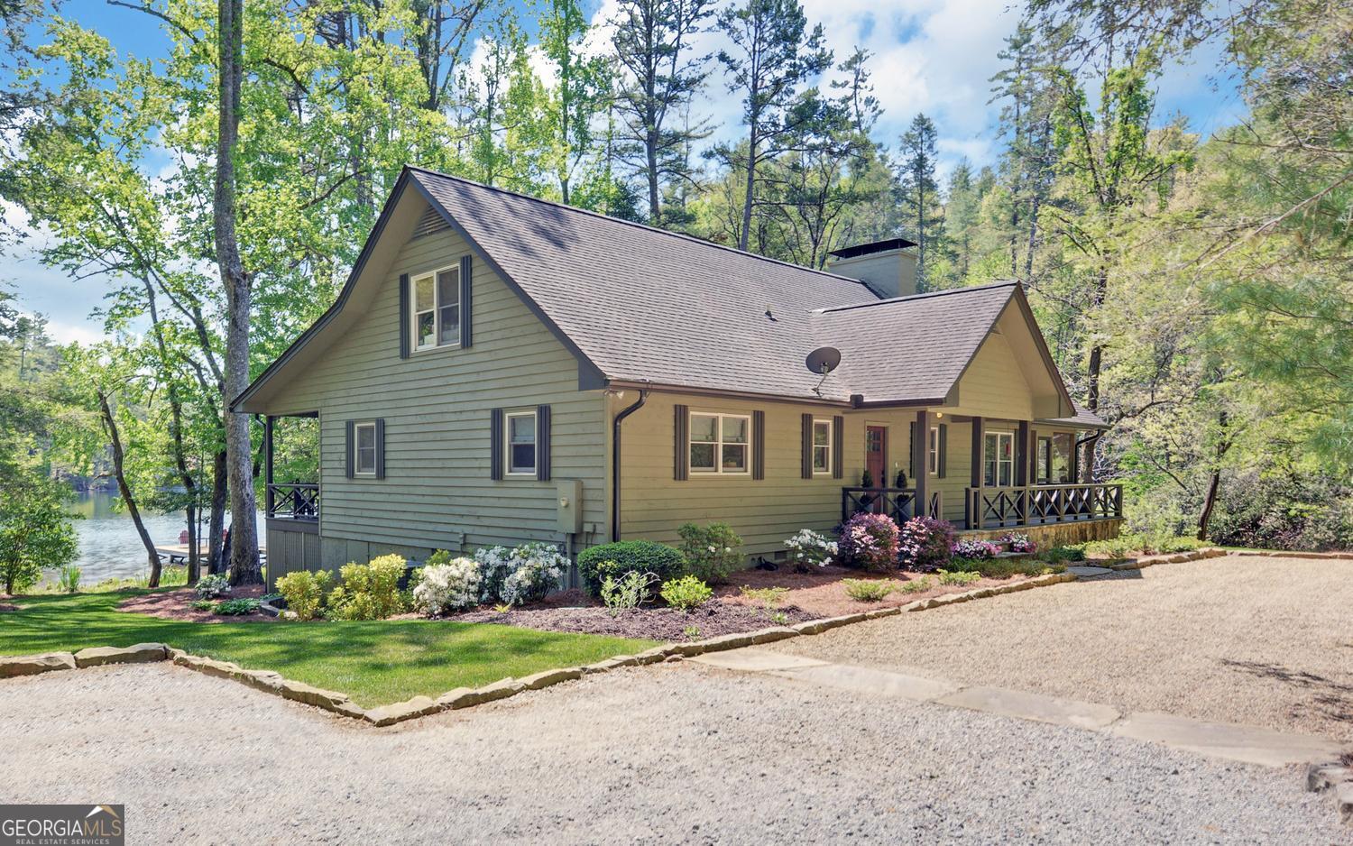 2857 Crow Creek Road Lakemont, GA 30552 - Photo 2 of 74 a view of a house with a yard and tree s