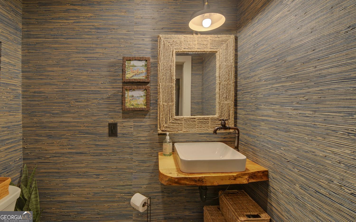 2857 Crow Creek Road Lakemont, GA 30552 - Photo 26 of 74 a bathroom with a toilet and a sink