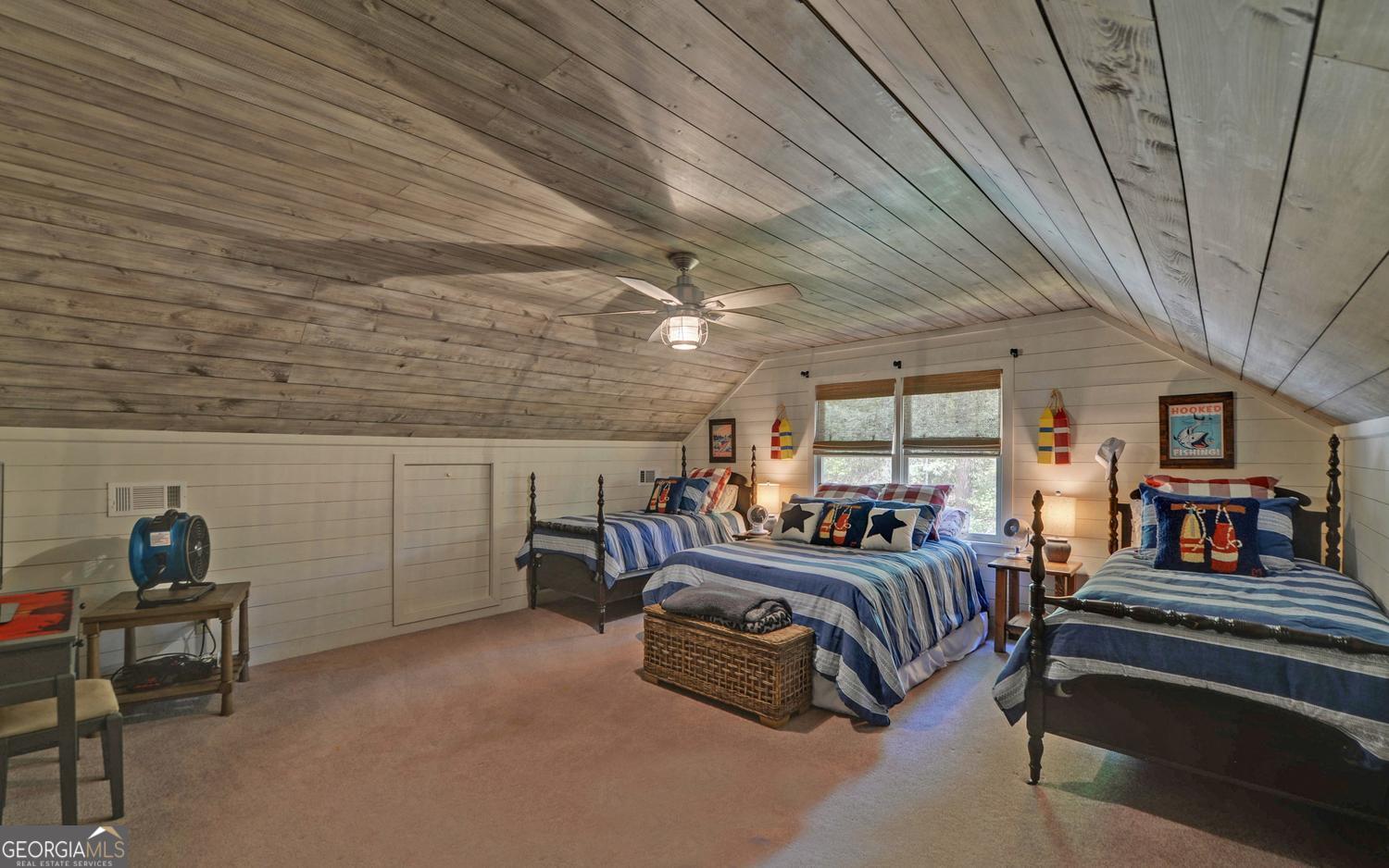 2857 Crow Creek Road Lakemont, GA 30552 - Photo 33 of 74 a bedroom with furniture and a ceiling fan