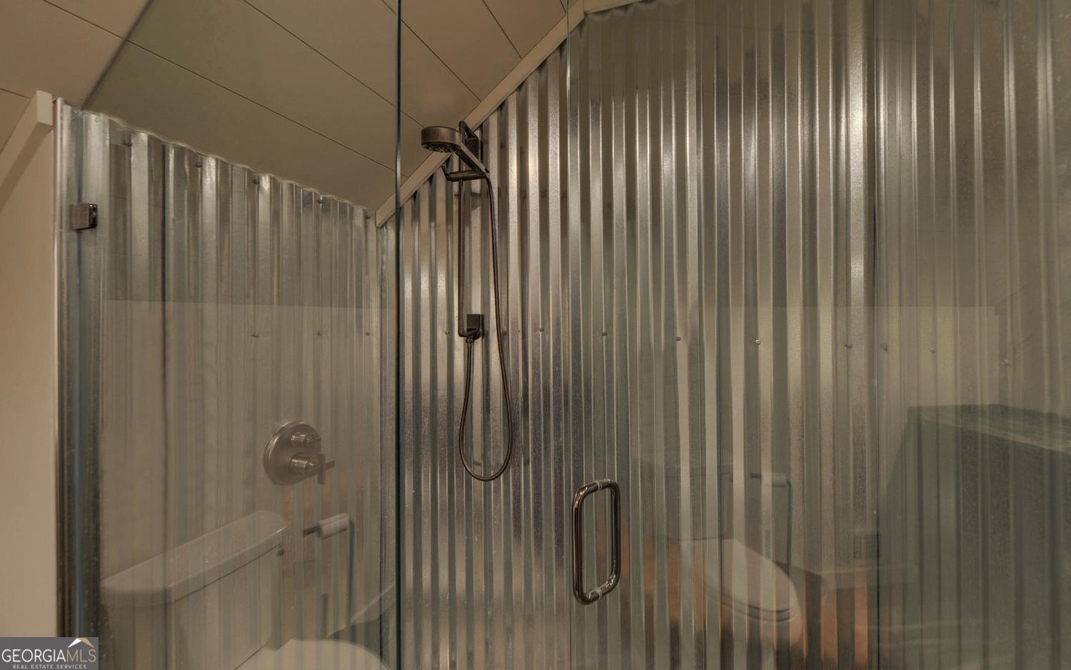 2857 Crow Creek Road Lakemont, GA 30552 - Photo 35 of 74 a bathroom with a shower and a tub