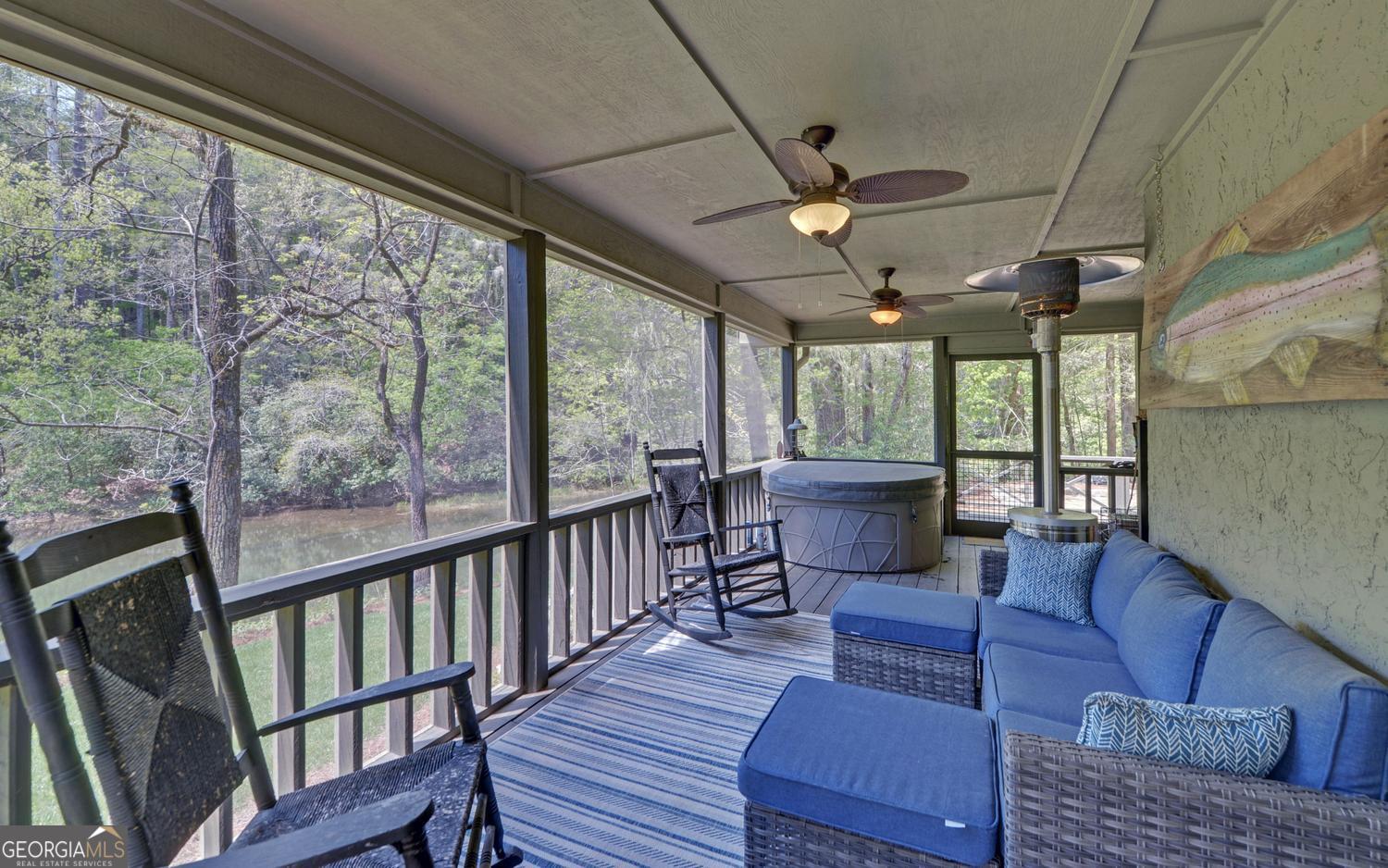 2857 Crow Creek Road Lakemont, GA 30552 - Photo 41 of 74 a living room with furniture and a large window