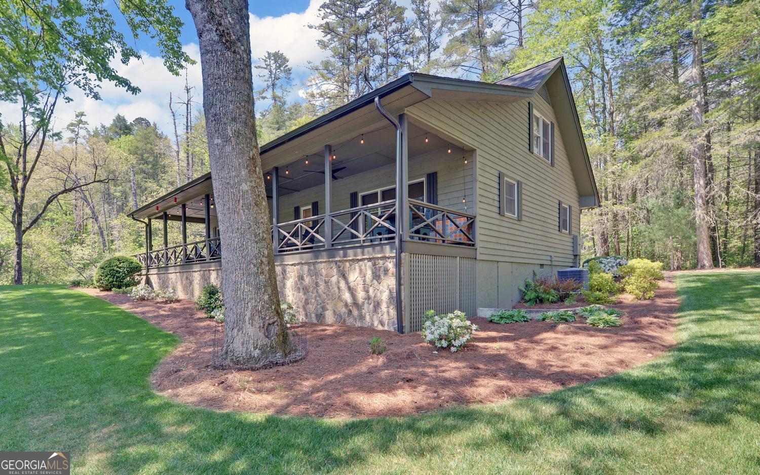 2857 Crow Creek Road Lakemont, GA 30552 - Photo 46 of 74 a front view of a house with garden