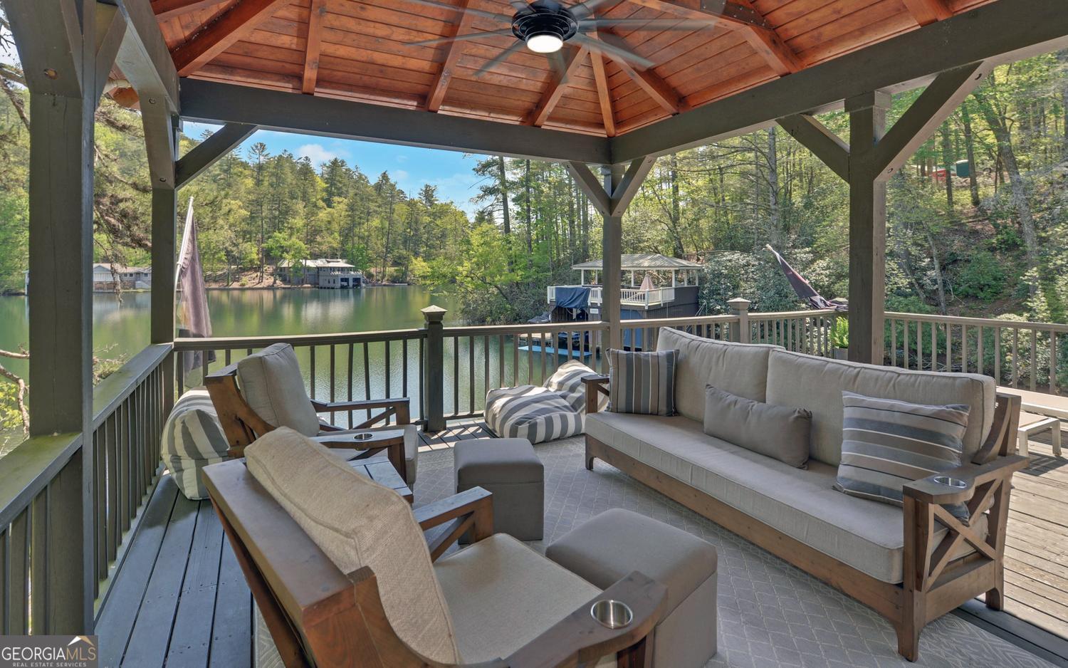 2857 Crow Creek Road Lakemont, GA 30552 - Photo 53 of 74 a view of a patio with couches chairs and a potted plant