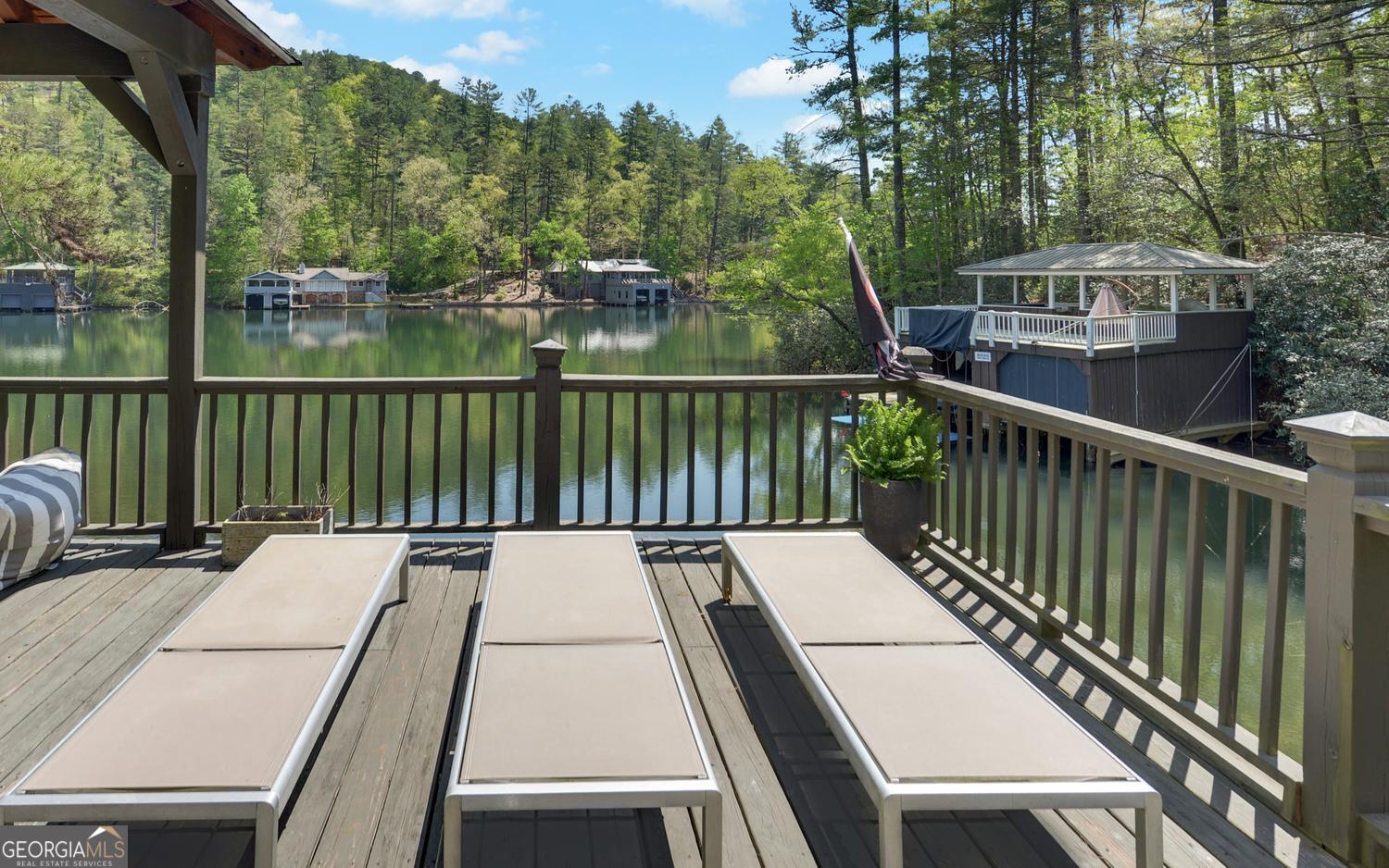 2857 Crow Creek Road Lakemont, GA 30552 - Photo 56 of 74 a view of balcony with wooden floor and outdoor seating