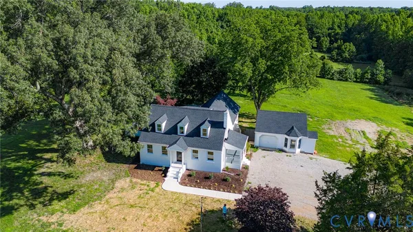 an aerial view of a house with a garden