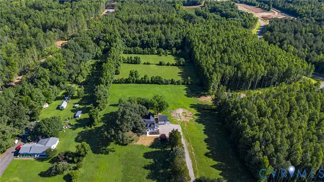 a kitchen with a sink a window and cabinets