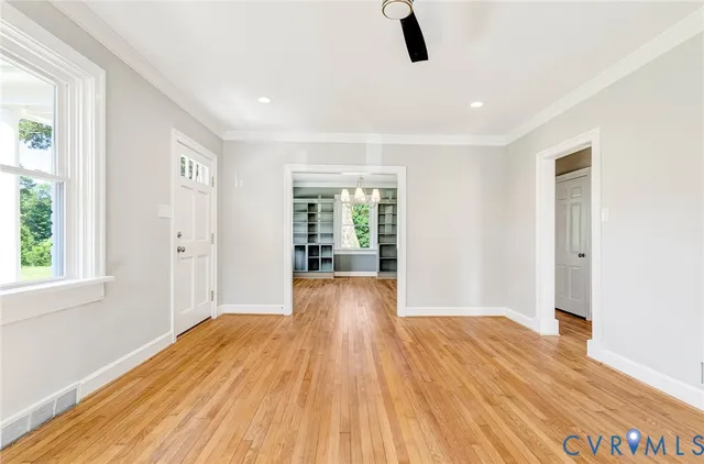 a spacious bathroom with a granite countertop toilet a sink and a mirror